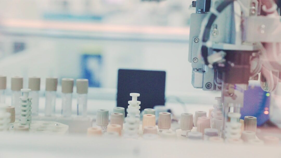 Advanced white humanoid robot looking at camera in laboratory