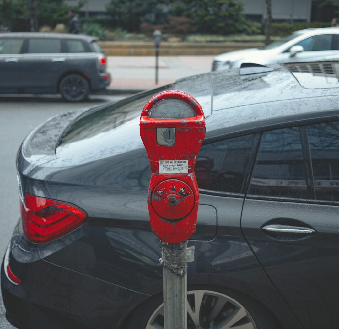 Electric vehicle charging cable connected to modern EV car